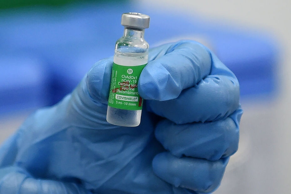 A health worker holds a vial of Covishield, AstraZeneca's Covid-19 coronavirus vaccine