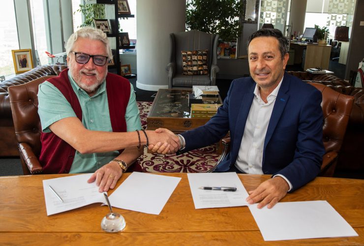 Raed Barqawi signing the publishing agreement for Who Dared to Dream: How Mohammed bin Rashid Made His Dream of Dubai Come True with Ian Fairservice, Managing Partner of Motivate Media Group