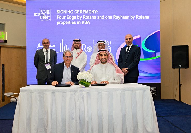 Rotana's Guy Hutchinson signs the agreement at the FHS in Riyadh. (Image: Supplied by Rotana)