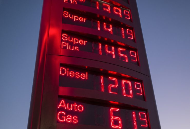 Diesel prices at a gas station at dusk.