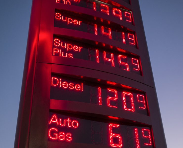 Diesel prices at a gas station at dusk.